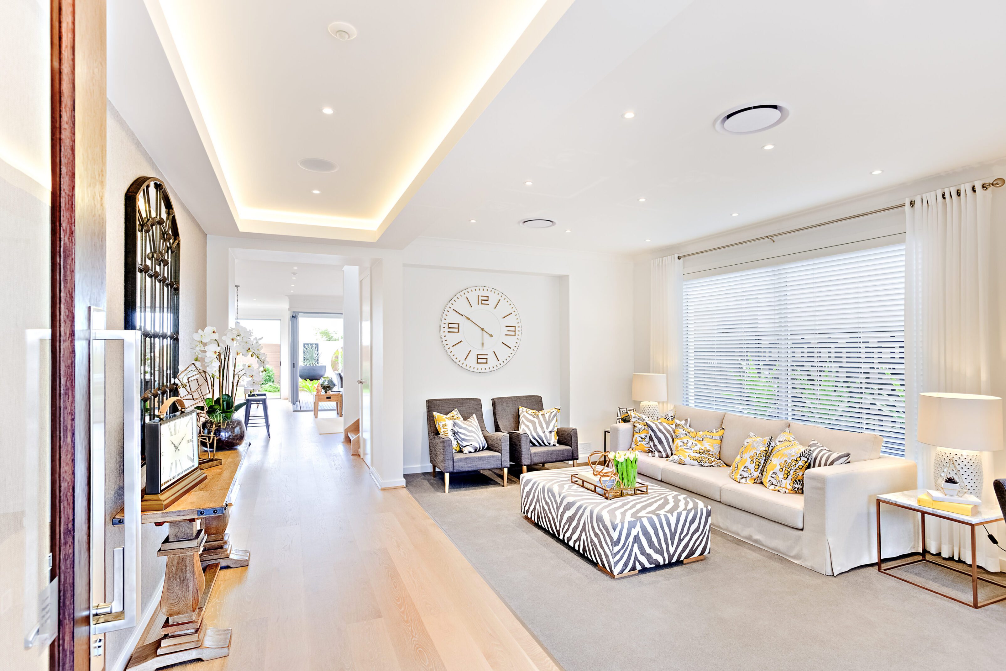 Bright and airy modern living room with cozy seating and elegant decor.